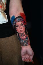 A portrait or image in color or black and white; this piece covers the entire outer or inner forearm and is completed in two sessions.