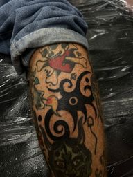 They’re perfect for filling small or irregular spaces, adding a classy touch while making the surrounding tattoos stand out.