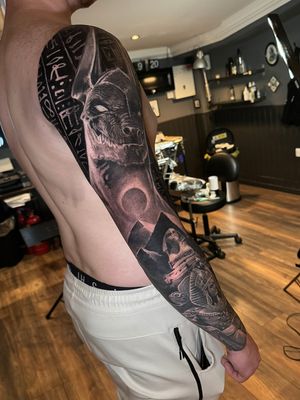 black and grey egyptian full sleeve realistic and surrealistic tattoo with cleopatra anubis hieroglyph and much more done by Alo Loco tattoo artist in London UK