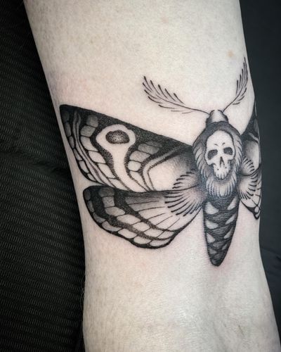 Intriguing blackwork and dotwork illustration of a moth symbolizing death by talented artist Amandine Canata.