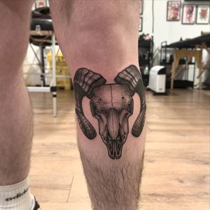 Intricate black and gray dotwork by Lawrence Canham, featuring a unique blend of a goat, skull, and ram motif.