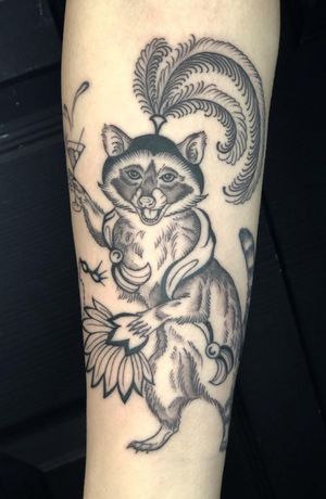 Get a stunning black and gray raccoon tattoo with a vintage twist by expert artist Amandine Canata.