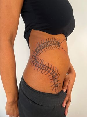 Get inked with a detailed and unique centipede tattoo from renowned artist Dave Norman. Stand out from the crowd with this insect motif design.