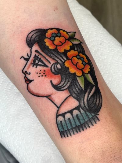 Traditional style tattoo of a Hawaiian woman by Clara Colibri. Features iconic elements of Hawaii.