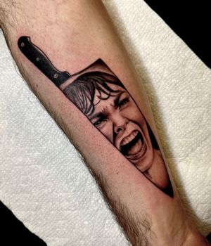 Illustrative black and gray tattoo of a knife, paying homage to the iconic scene from the movie Psycho, by Miss Vampira.