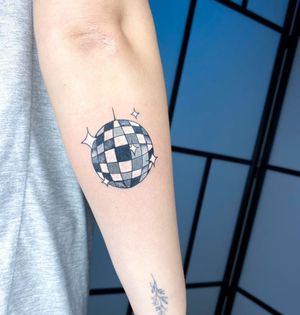 Get groovy with this black and gray disco ball tattoo by the talented artist Alfonso Barberio. Perfect for dance lovers!