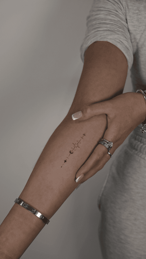 Celestial forearm tattoo