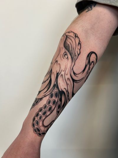 Blackwork and dotwork tattoo of an intricately detailed octopus by Jack Howard.