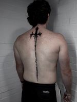 Spine Sword Blackwork Tattoo