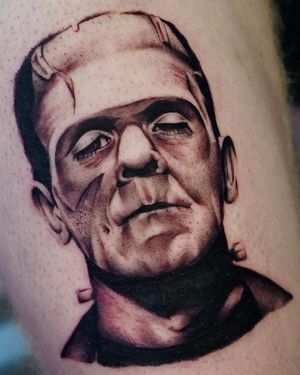 Get a spooky black and gray illustrative tattoo of Frankenstein's monster by Miss Vampira, inspired by the classic movie.