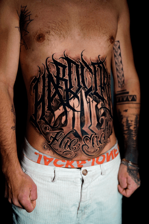 Bold lettering tattoo style