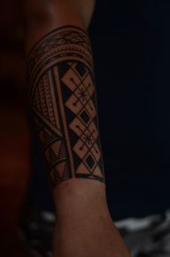 Polynesian-inspired Geometric Arm Tattoo