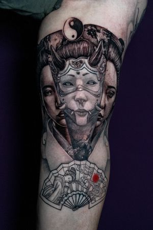 Realistic black and gray tattoo featuring a geisha and oni from Japanese folklore by artist Warren Mullins.