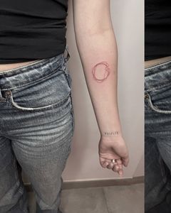 Red Scribbled Circle Tattoo