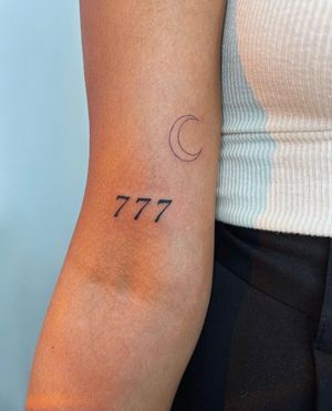 Get a sophisticated touch with this small lettering tattoo by Alessia Lo Piccolo. Perfect for minimalistic style lovers.