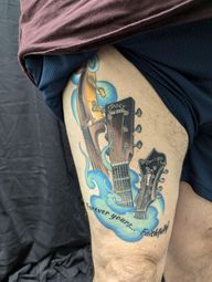 Fully custom full color tattoo of musical instruments (Cello, guitar, mandolin) for a client who plays each one in a bluegrass band.