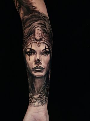 Black and gray realism tattoo of a mysterious gypsy woman with a clown twist, by Mauro Imperatori.