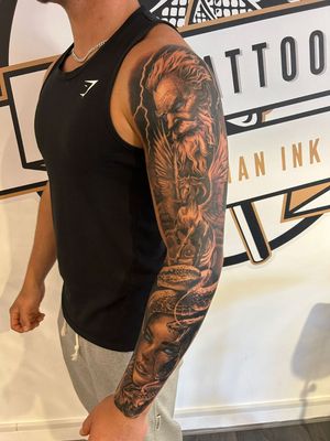 A stunning black and gray tattoo featuring Zeus, Pegasus, and Medusa from Greek mythology, created by Epic Tattoos Guildford in a realistic style.