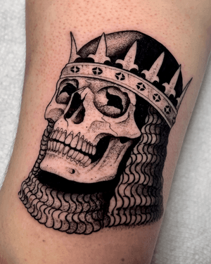 Blackwork dotwork tattoo featuring a detailed skull and knight design by Andrew Garinther.