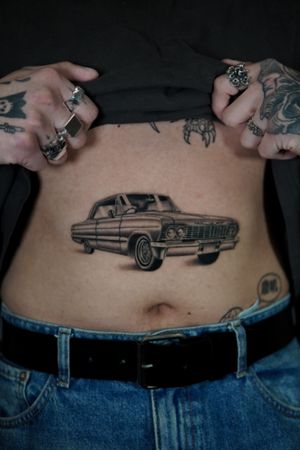 Immerse in the nostalgia with this micro-realism black and gray tattoo by Joshua Williams. Perfect for vintage car enthusiasts.