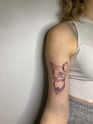 Discover the mystical allure of an Egyptian cat with this blackwork, fine line, and illustrative tattoo by Robert Buckley-Warner.