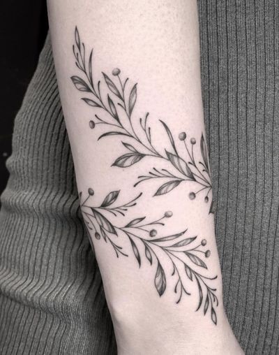 Capture the essence of nature with this illustrative tattoo featuring a tree, vine, and branch design by Amandine Canata.