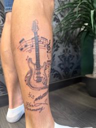 Electric Guitar and Music Notes Tattoo