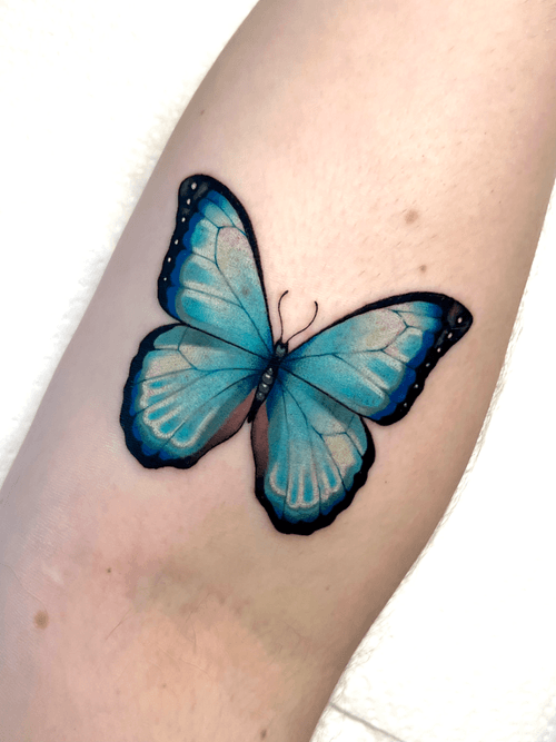 Vibrant Blue Butterfly Tattoo