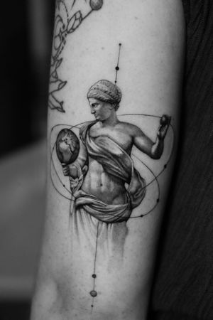 Experience the intricate beauty of Greek mythology with this stunning micro-realism tattoo by Light Grays. Featuring a black and gray fine line design, this tattoo captures the essence of ancient statues with a modern twist.