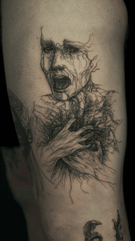 Distressed Face Tattoo