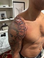 Clock and Face Shoulder Tattoo