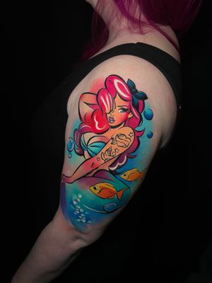 Get mesmerized by this illustrative watercolor tattoo of a beautiful mermaid inspired by Ariel, done by Cloto.tattoos.