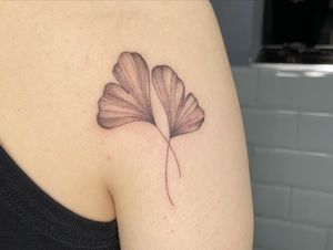 Beautiful illustrative tattoo featuring detailed ginko leaves design by Anggi Kokovikas. Perfect for nature lovers!