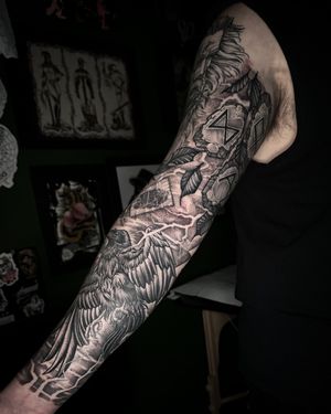 Finished Norse inspired neotraditional sleeve, background and some elements still fresh, rest healed.