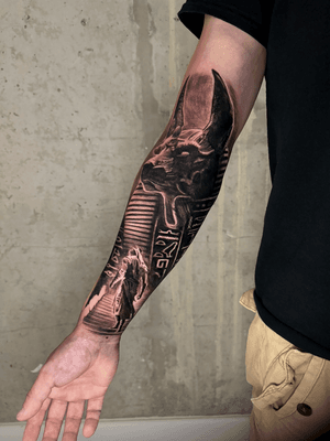 black and grey egyptian sleeve realistic and surrealistic tattoo anubis and hieroglyph, best artist London uk