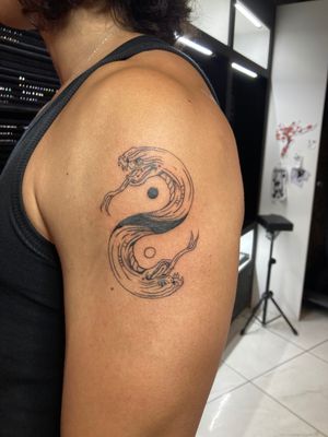 Unique blackwork and fine line design by Robert Buckley-Warner, combining a snake with yin yang symbol