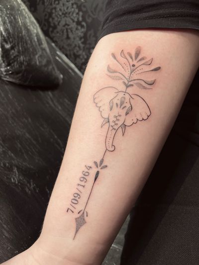 Delicate fine line, soft shading and dotwork adornments for a first tattoo in the forearm 