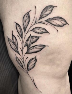 Embrace nature with this illustrative tattoo by Amandine Canata featuring a tree branch and leaves design.