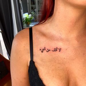 Elegant and bold blackwork Arabic lettering tattoo done by the talented artist Robert Buckley-Warner. Perfect for those looking for a unique and meaningful design.