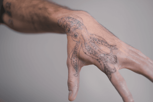 Detailed Octopus Hand Tattoo