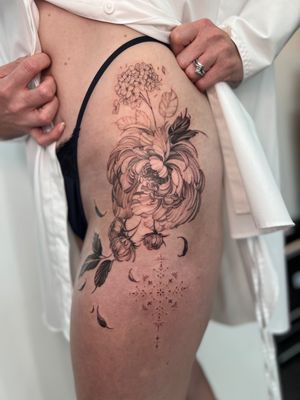 Adorn your skin with a stunning floral masterpiece by tattoo artist Alex Caldeira. This ornamental design features intricate chrysanthemum flowers.