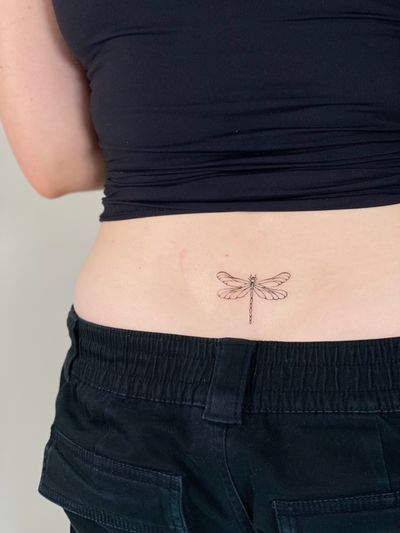 Fine line illustrative tattoo of a delicate dragonfly by ᴢᴜᴢᴀɴɴᴀ.