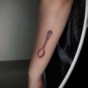 Experience micro-realism with this illustrative black and gray tattoo of a vintage spoon, beautifully executed by Isla.
