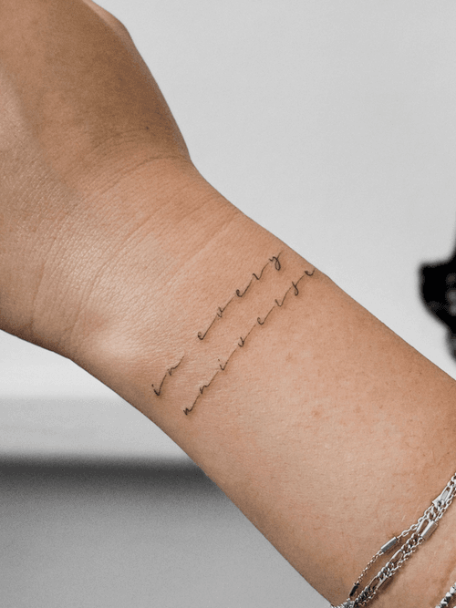 In Every Universe Wrist Script Tattoo