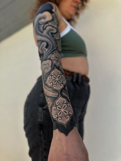 Embrace the intricate beauty of this blackwork dotwork mandala tattoo design created by the talented artist Giada.