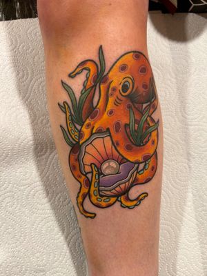 Beautiful neo-traditional tattoo by Lawrence Canham featuring an octopus, pearl, and seashell motif.