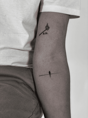 Black and gray fine line tattoo featuring a bird and matchstick motif, created by ᴢᴜᴢᴀɴɴᴀ