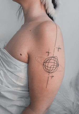 Abstract geometric tattoo by Alexey featuring a fine line singleline design of a disco ball with sparkle details.