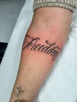 Freedom Cursive Lettering Tattoo