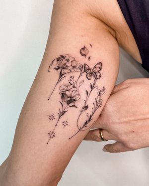Beautifully detailed floral and butterfly design by Alex Caldeira, showcasing intricate fine line work.